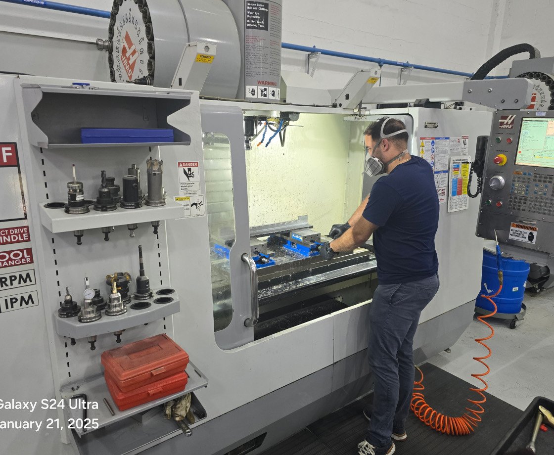 Machinist operating a CNC mill