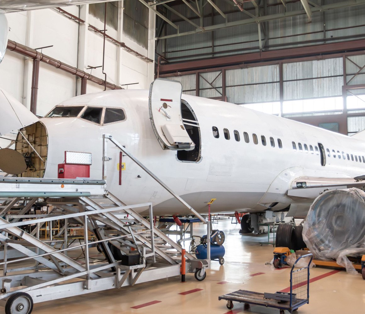 Commercial aircraft in a maintenance hangar